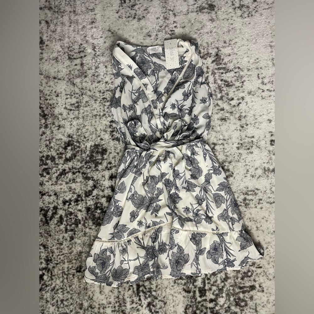 Black and white tie dress. Brand: Sienna sky. Size Small.